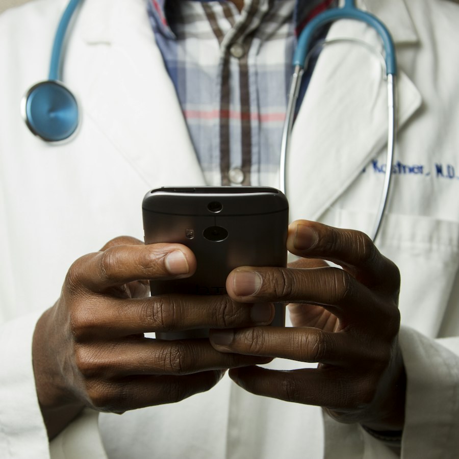 Clinician using a mobile device to review remote patient monitoring data